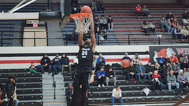 Darryn Peterson of Huntington Prep dunks in warmups before a game against Richmond Heights on February 17, 2024